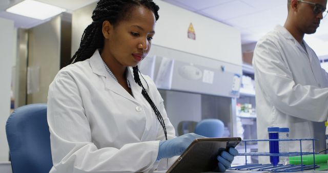 Scientist Analyzing Data on Tablet in Modern Laboratory - Download Free Stock Images Pikwizard.com