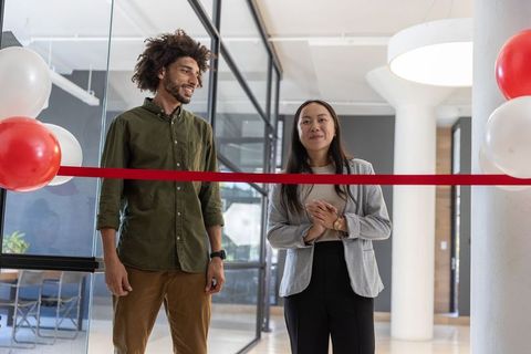 Coworkers Conducting Business Opening Ceremony in Office Lobby