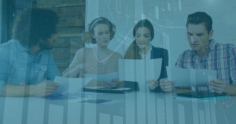 Business team focuses on reviewing data analysis in modern office