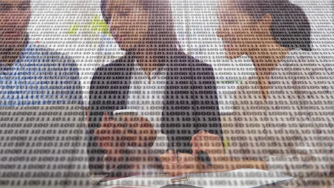 Business Team Analyzing Data with Binary Code Overlay