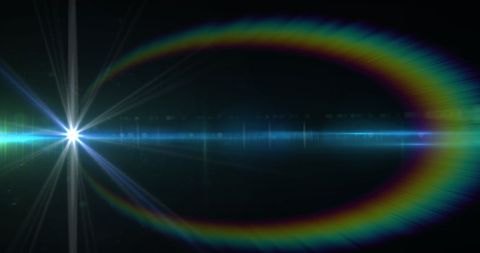Vibrant lens flare with rainbow halo on black background