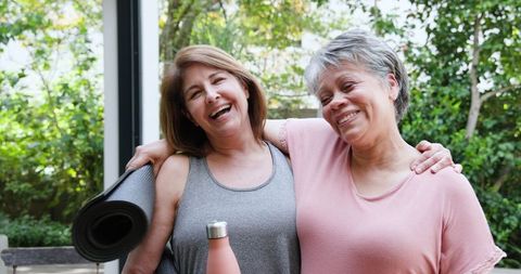 Happy Mature Women Embracing Wellness Outdoors