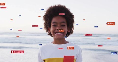 Happy child interacting with social media by the ocean