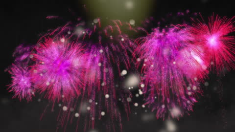 Vibrant Pink Fireworks Exploding Amidst Dancing Lights