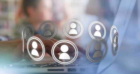 Businesswoman Networking with Digital Icons on Laptop