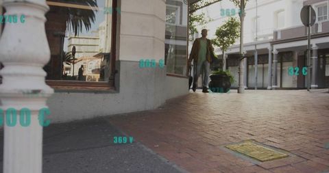 Man walking on brick sidewalk with augmented reality data overlay