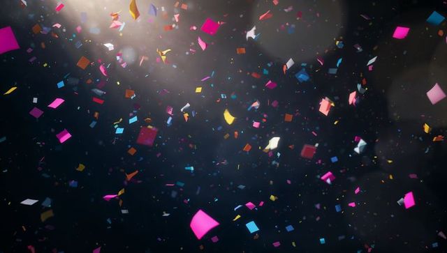 Colorful Confetti Explosion Against Dark Background
