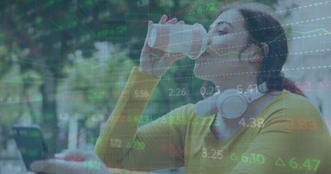 Caucasian Woman Connected to Stock Market Data, Coffee in Hand