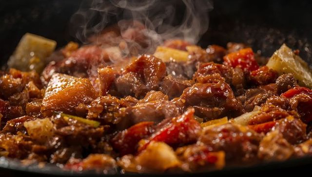 Sizzling glazed beef and pineapple stir-fry with red peppers in glossy caramelized sauce