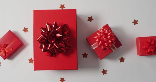 Perfect for holiday promotions, party invitations, and celebration ads. Highlights festive atmosphere with gift boxes and decorative bows surrounded by star-shaped confetti. Ideal for Christmas or any seasonal advertisement.