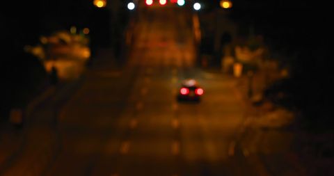 Blurred Night City Street with Car Tail Lights