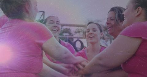 Women Stacking Hands in Celebration at Outdoor Fitness Area