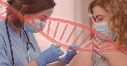 Healthcare worker administering covid-19 vaccine to patient with red dna strand overlay in clinic
