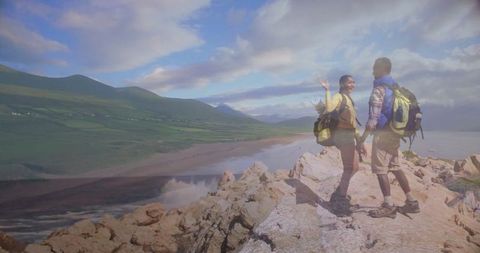 Hikers Enjoying Stunning Beach View from Scenic Cliff