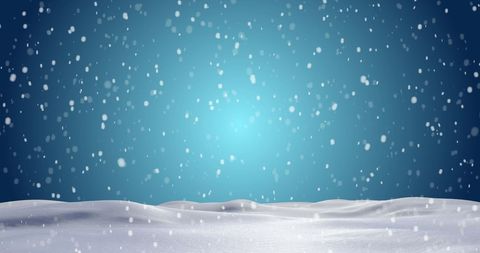Snowfall winter scene with soft blue background