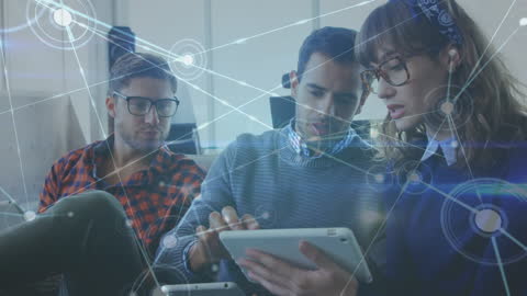 Colleagues Collaborating with Digital Touchscreen Technology