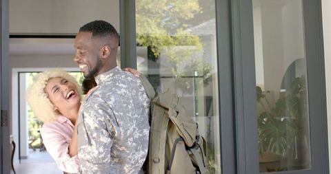 Soldier Reunites With Loved One in Modern Home Interior