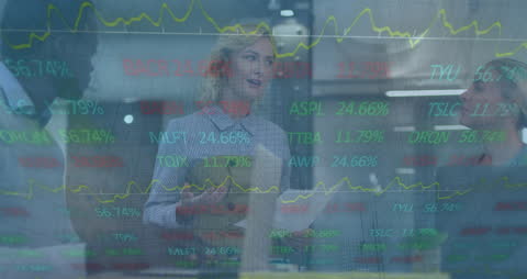 Diverse Business Team Discusses Financial Data with Innovative Technology