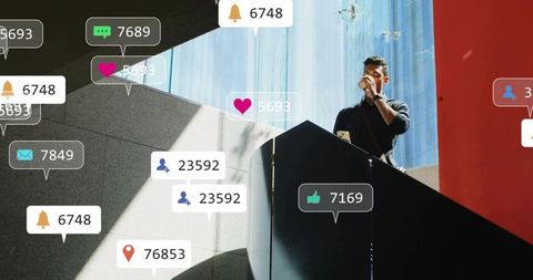Man checking phone and sipping coffee on modern atrium staircase with social media alerts
