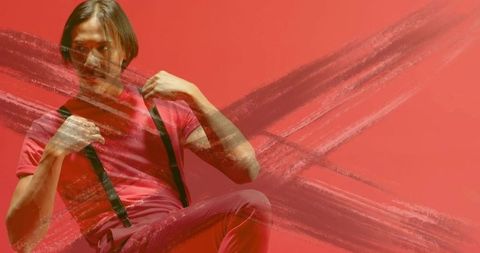 Creative portrait of man in red outfit with artistic touches