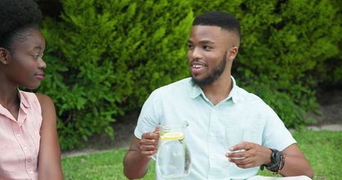 Couple Enjoying Relaxed Outdoor Picnic in Garden