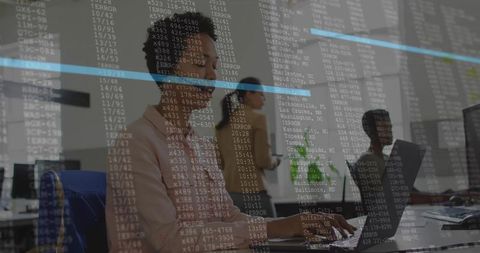 Middle-aged woman typing at workstation with translucent data overlay and analytics