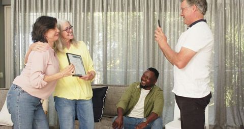 Joyful group therapy session with diverse participants celebrating achievement