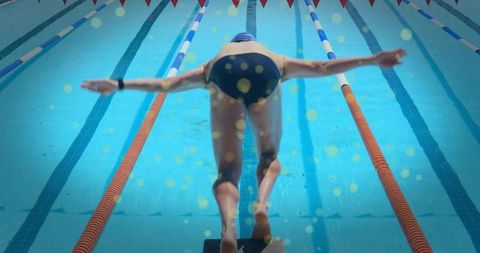 Male Swimmer Prepares to Dive During Intense Swimming Competition