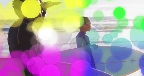 Surfer and Instructor Amid Ocean Waves with Abstract Light Flares