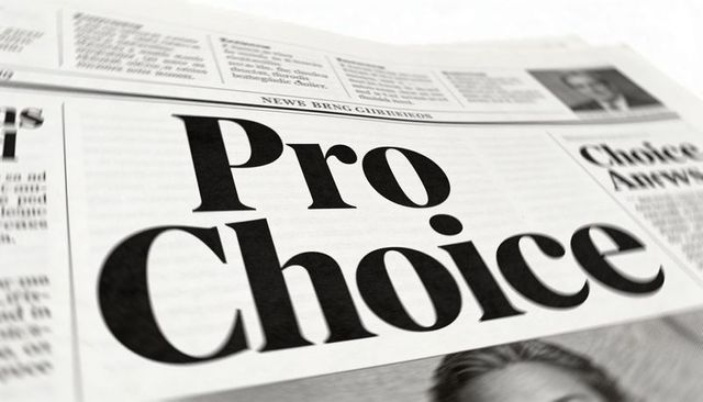 Pro choice headline on tilted newspaper frontpage emphasizing bold serif typography and layout
