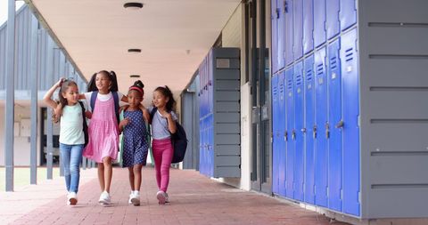 Diverse Group of Students Walking in School Hallway with Backpacks - Download Free Stock Images Pikwizard.com