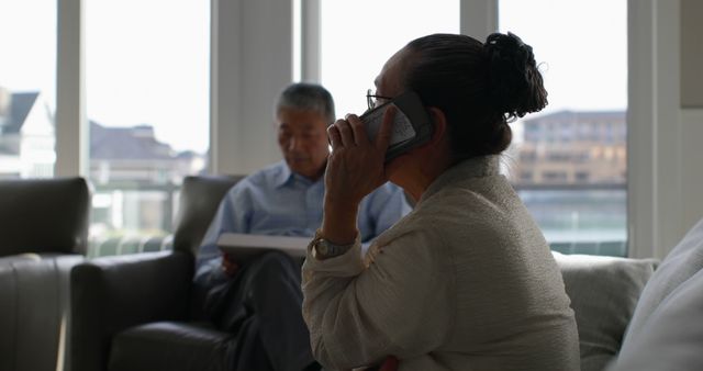 Elderly Woman Taking a Phone Call in Living Room - Download Free Stock Images Pikwizard.com