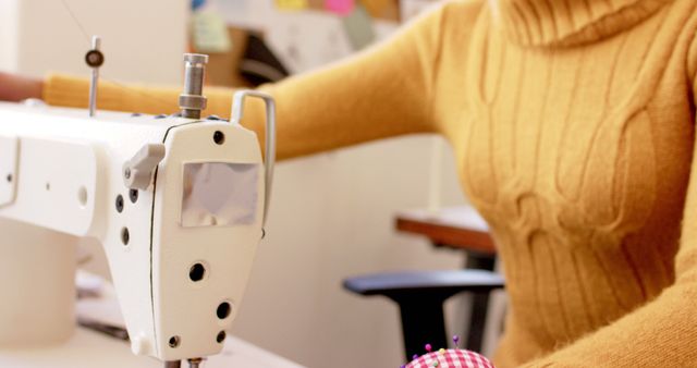 Fashion Designer Using Sewing Machine in Creative Workspace - Download Free Stock Images Pikwizard.com