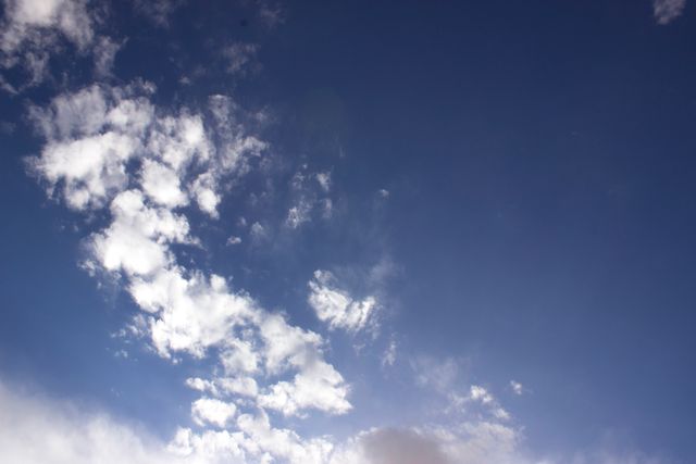 Blue Sky with White Fluffy Clouds on a Bright Day - Download Free Stock Photos Pikwizard.com