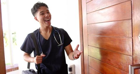 Friendly Male Nurse Greeting with Stethoscope & Backpack
