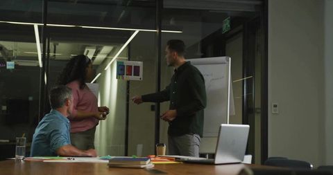 Team collaborating on color selection in modern boardroom