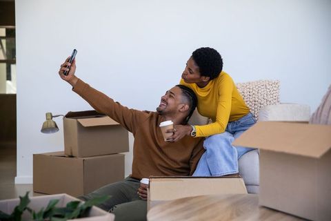 Couple Taking Selfie While Unpacking in New Home