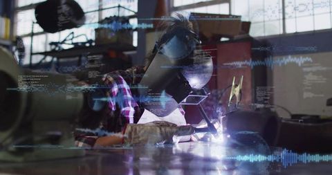 Female Welder Welding Metal with Augmented Reality Overlay in Industrial Workshop