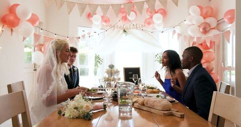 Joyful Multiracial Wedding Celebration in Cozy Home Setting