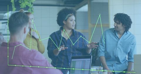 Diverse team analyzing financial data during meeting