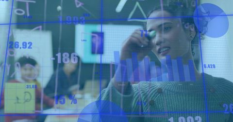 Businesswoman Analyzing Data and Writing on Glass Wall