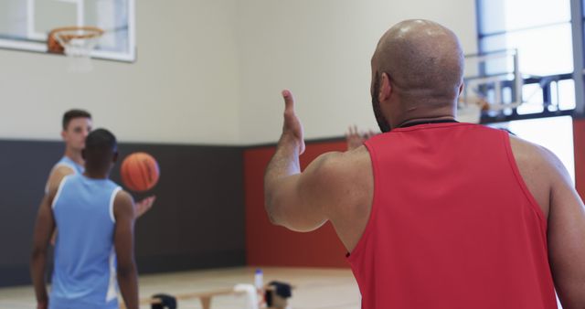 Basketball Instructor Coaching Young Players on Indoor Court - Download Free Stock Images Pikwizard.com