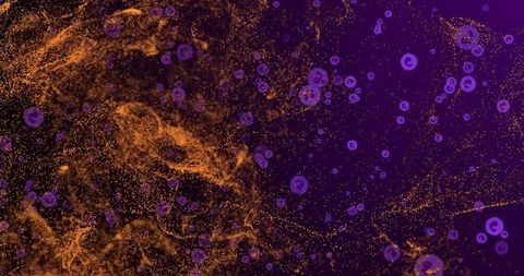 Glowing golden filaments and purple orbs drifting across abstract cosmic nebula background