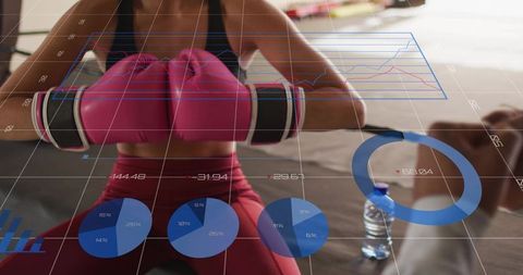Female Boxer Training with Holographic Performance Charts and Fitness Analytics