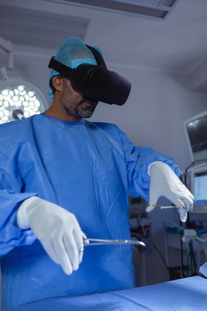 Front view of Male surgeon using virtual reality headset while practicing surgery in operation room at hospital