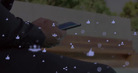 Businessman Connecting Online Using Smartphone with Social Media Icons