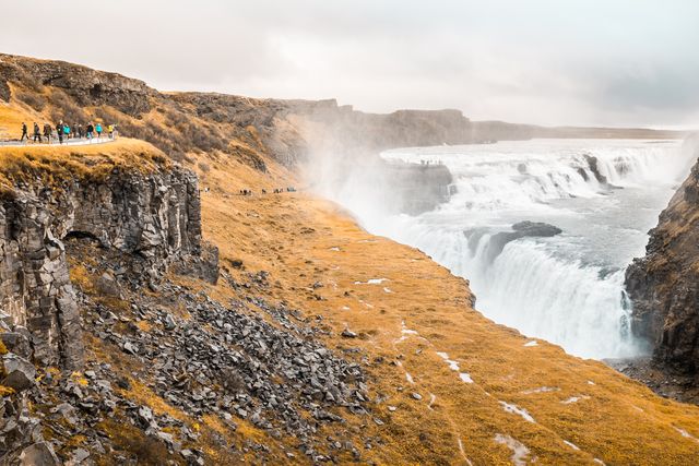 Tourists Admiring Gullfoss Waterfall in Beautiful Icelandic Landscape - Download Free Stock Images Pikwizard.com