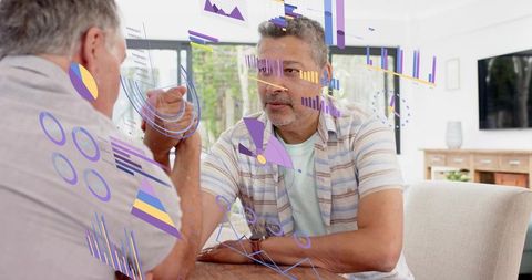 Mature man competing in arm-wrestling while augmented charts visualizing performance