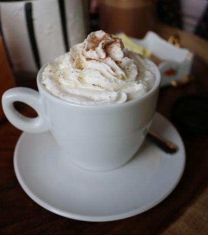 Cozy cappuccino with whipped cream and cinnamon