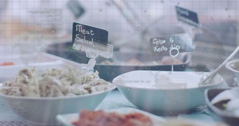 Muted cafe buffet featuring white ceramic bowls, chalk labels and dotted world map overlay